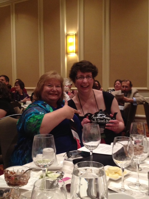 Toni LP Kelner and Dana Cameron celebrate Dana's Agatha win at Malice Domestic in Bethesda. (Photo courtesy of Dan Hale.)